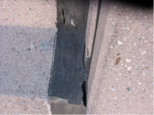 failed sealant at an expansion joint in precast concrete panels